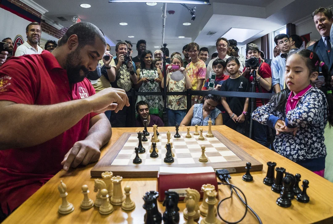 John Urschel faces off with Rachael Li at the Saint Louis Chess Club in 2017. (Photo courtesy SLCC/Lennart Ootes)