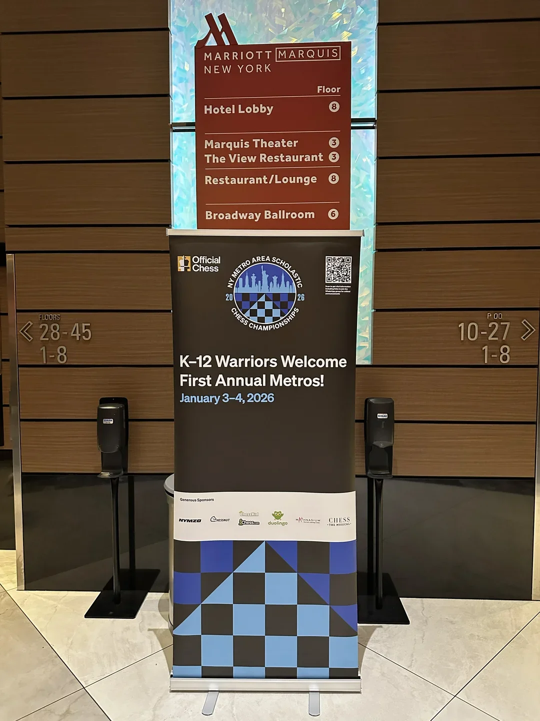 A sign at the Marquis Hotel welcoming "K-12 Warriors"