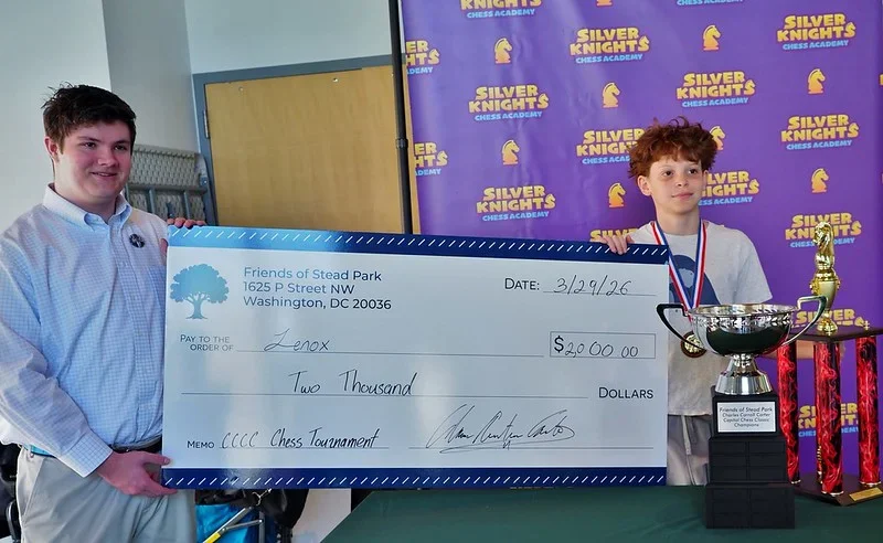Scholarship winner Lenox Serrette holds his check. Photo by Phil Carney.