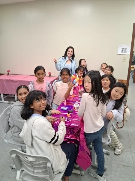 Carolina Blanco (standing in back) and Girls Club Room fingernail painting