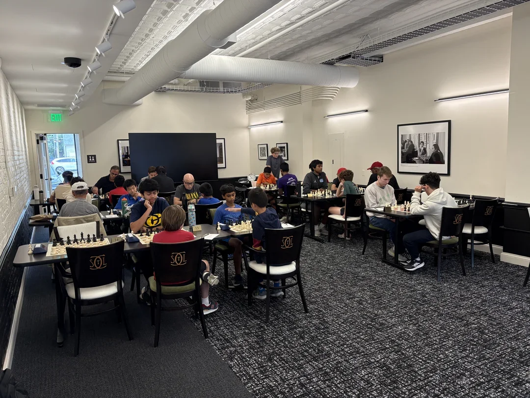 Chess fans get some games in before the start of Round 2.