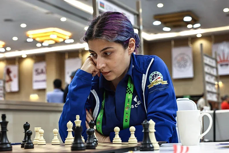 WGM Tatev Abrahamyan taking stock of her position during Round 1 of the 44th FIDE Chess Olympiad. Photo: Livshitz