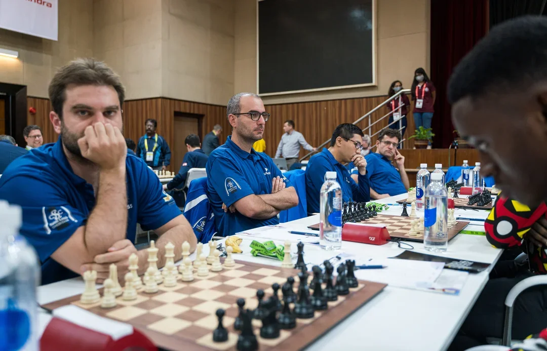 The U.S. team patiently awaits the start of their first round match against Angola at the 44th FIDE Chess Olympiad. Photo: Ootes