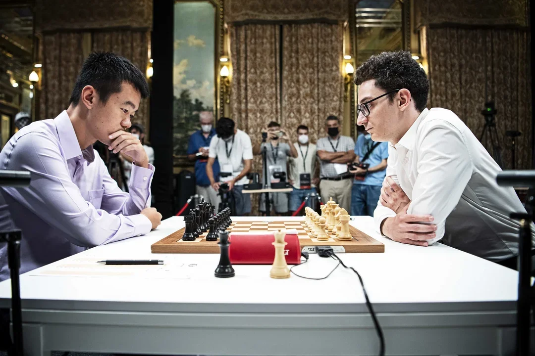 Ding Liren and Fabiano Caruana square off in Round 11 of the 2022 FIDE Candidates. Photo: Stev Bonhage/FIDE