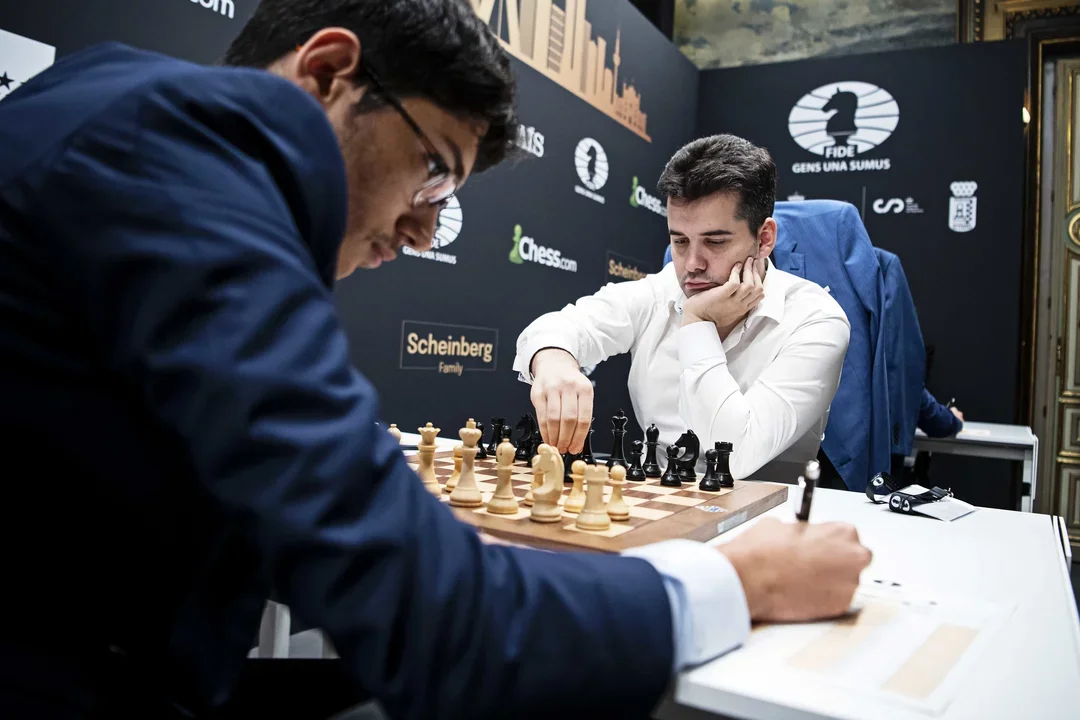 Ian Nepomniachtchi moves against Alireza Firouzja in Round 11 of the 2022 FIDE Candidates. Photo: Stev Bonhage/FIDE