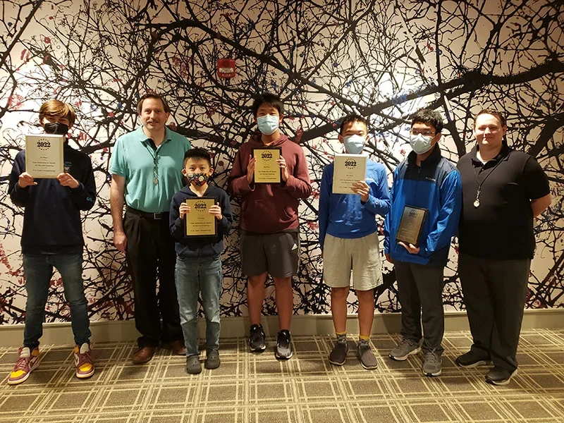 The top finishers of the 2022 U.S. Cadet Championship pose with their hardware. Photo: Micheline Wilson
