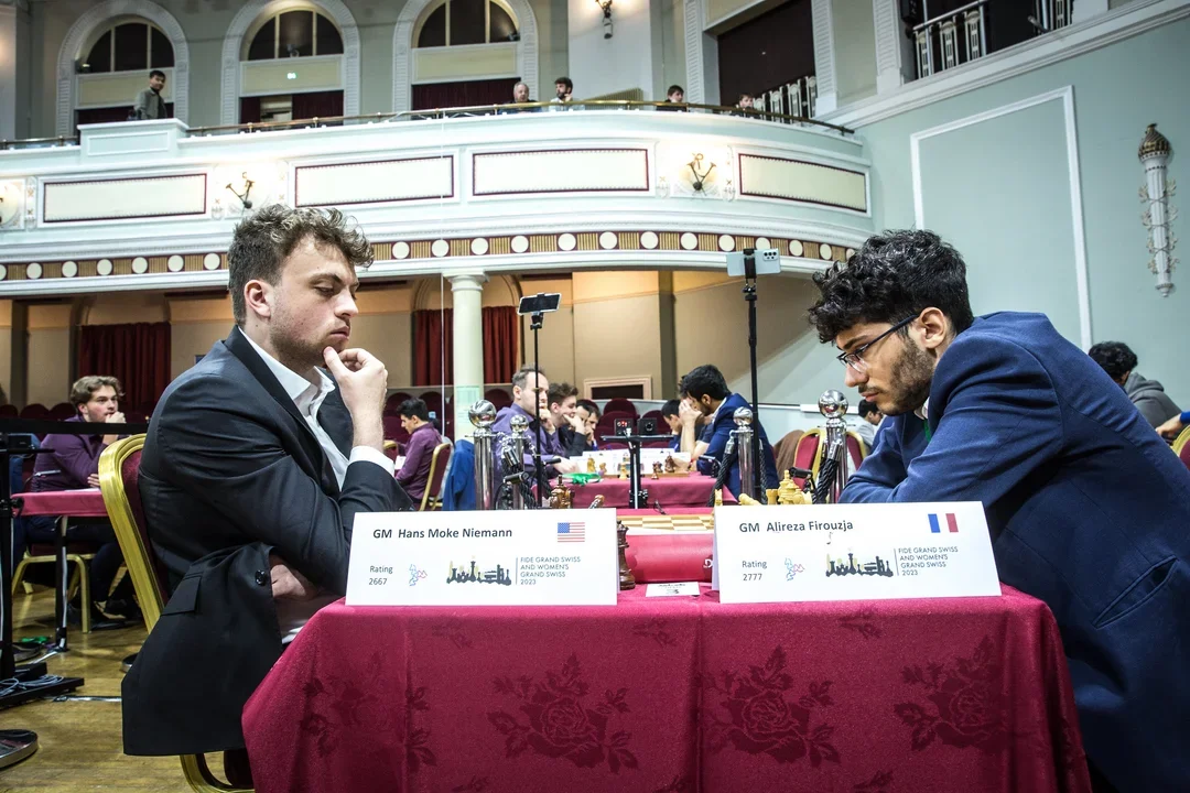 A solid start for Hans Niemann (L) included a draw against former candidate Alireza Firouzja (photo courtesy Anna Shtourman/FIDE)