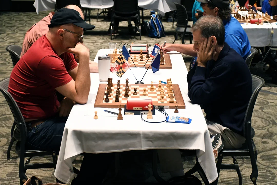 Fan favorite GM Jesse Kraai of the Chess Dojo (L) had a nice day at work (photo Daniel Day)