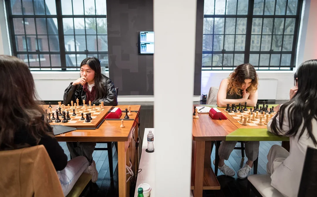Yip, left, plays Paikidze while, on the other side of a divider, Abrahamyan plays Lee