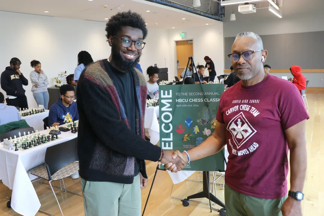 The Black Odyssey co-founder Alan Cowan (L) with volunteer coach Charles German
