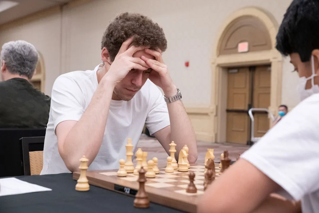 GM Daniel Naroditsky deep in thought at the 2022 US Open. Photo: Mark Cieslikowski