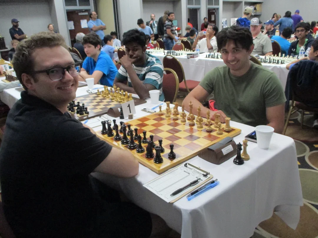 Andras Horvath (L) before his last-round draw with Craig Hilby. Sharvesh Deviprasath, who finished a half-point behind the co-champions, is to Hilby's left. (Photo by Alexey Root)