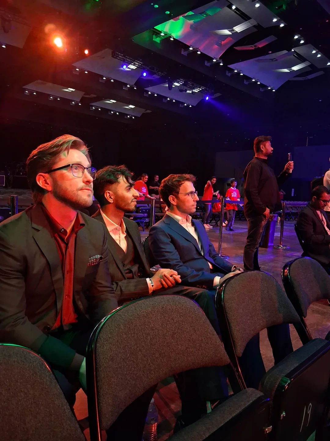 Co-host James Dash with commentators GM Harshit Raja and Robert Hess