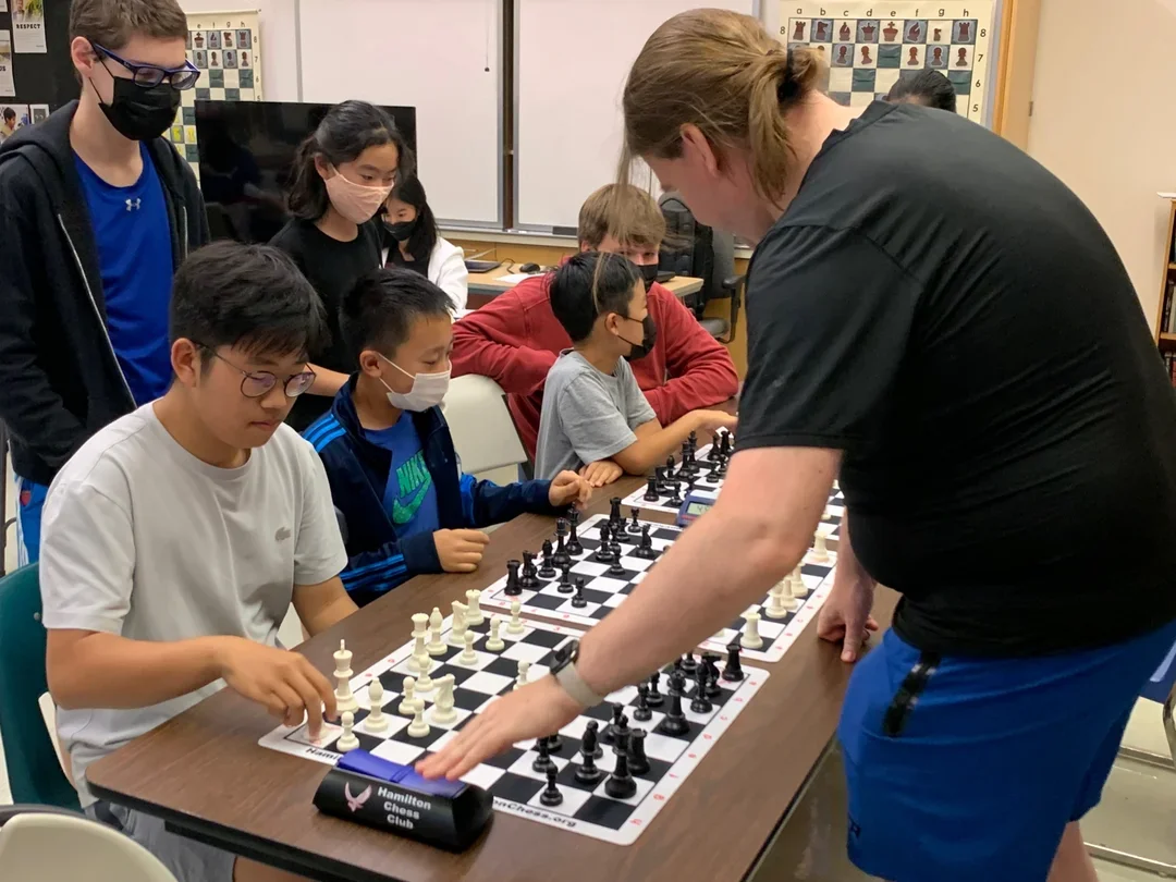 The author (left) during the blitz simul against GM Jacob Aagaard at the 54th U.S. Chess School.