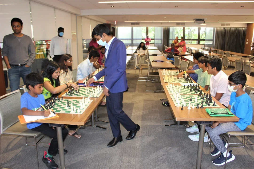 Pragg makes his way between boards at the special NYC simul. Photo: Jay Kleinman