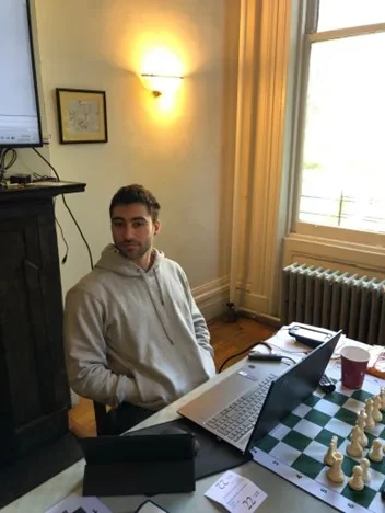 IM Alex Ostrovskiy teaching at the 53rd U.S. Chess School. Photo: Eugene Yoo