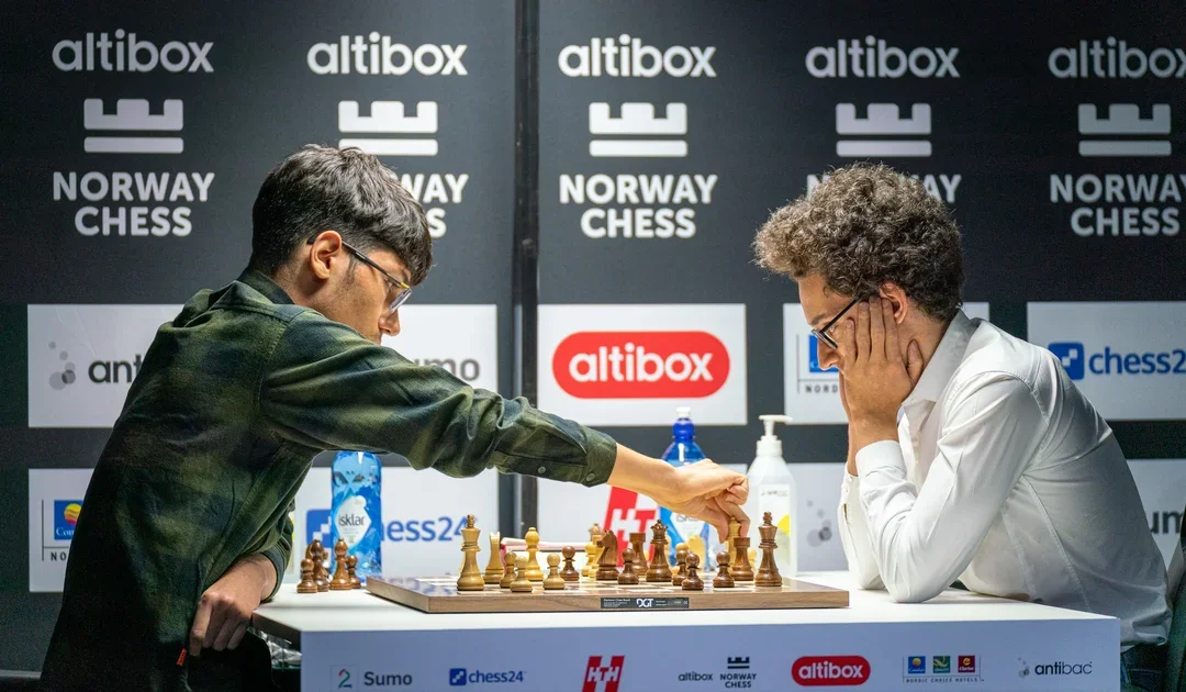 GM Alireza Firouzja makes his move against GM Fabiano Caruana in the third round of the 2020 Altibox Norway Chess tournament.