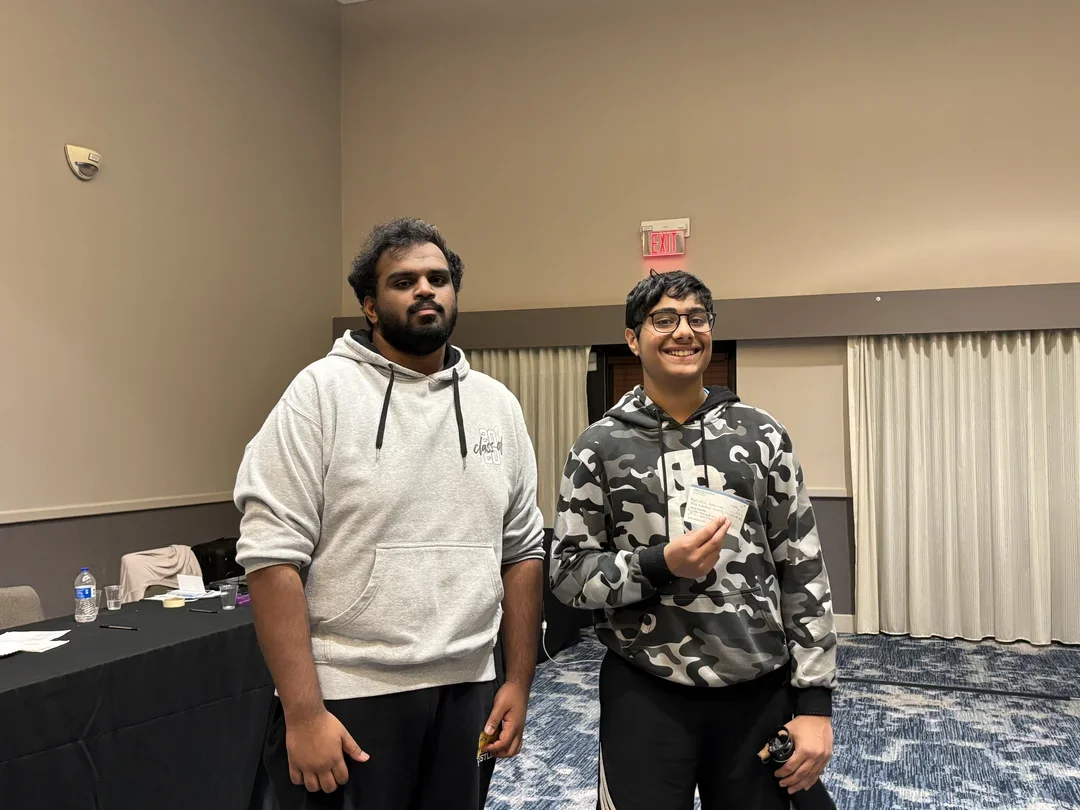 Akil Kumar Murugan (L) and Ariv Debmisra with their prizes from the FIDE-rated blitz event.