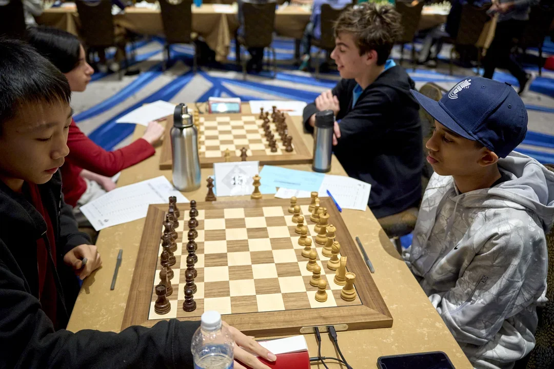 Top-seeded Eric Liu (Front left) was held to a draw by North Carolina's Nirav Natha, allowing Will Moorhouse (back right) to leapfrog in the standings after upsetting second-seeded FM Brejeth Chakrabarti (photo Caroline King)
