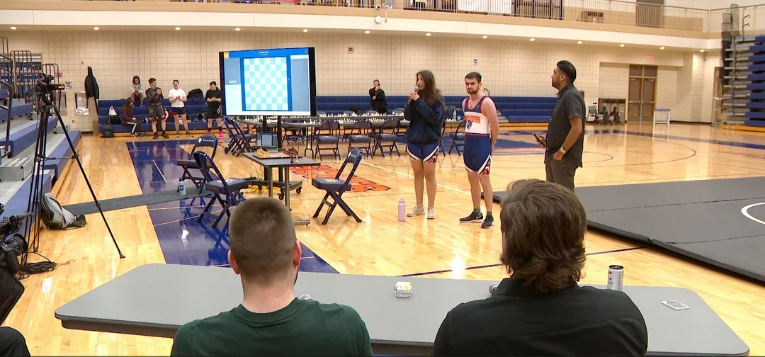 Organizers Sofia Doroshenko and Ionatan Giurgiu standing next to National Arbiter Jiten Patel, as John Bartholomew and Max Steigauf look on (Photo courtesy of CBS News)
