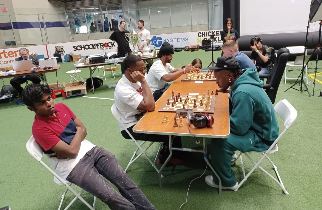 Sharvesh Deviprasath (L) watches his student Amari Cooper's game against Chidobe Awuzie (Photo Alexey Root)