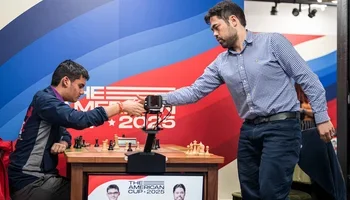 Nakamura shakes hands with Mishra