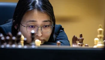 Ju Wenjun carefully studying her position towards the end of game 4