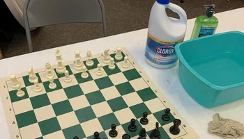 Chess boards being cleaned for the Iowa Closed