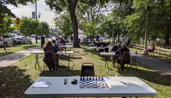 Outdoor chess tournament at the Lincoln Square Chess Club.