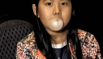 Rochelle Wu blowing a bubble at the board