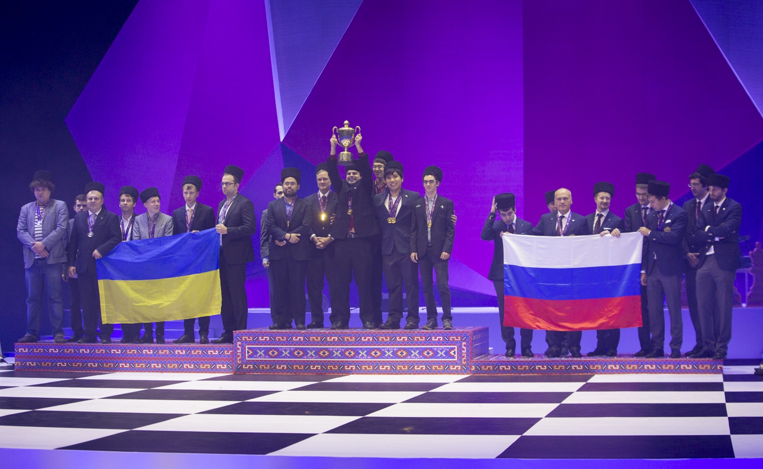 The US Team on the highest level on the Olympic podium along with the silver and bronze winners, Ukraine and Russia. Photo: Maria Emelianova, Official Website