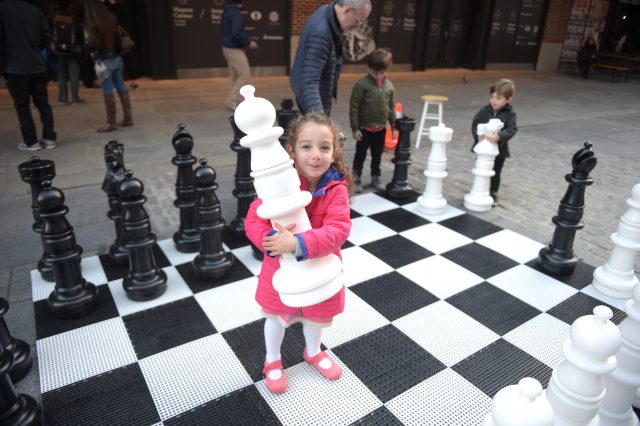 NEW YORK, NY - NOVEMBER 12: Young fans enjoy the atmosphere at the 2016 World Chess Championship at Fulton Market Building on November 12, 2016 in New York City. (Photo by Jason Kempin/Getty Images for Agon Limited)