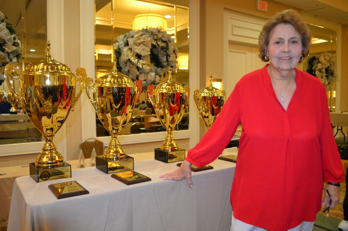 Chief Organizer Jean Troendle prepares to award gorgeous trophies to the top five teams. Cajun Chess gave away a lot more hardware to other winners as well.