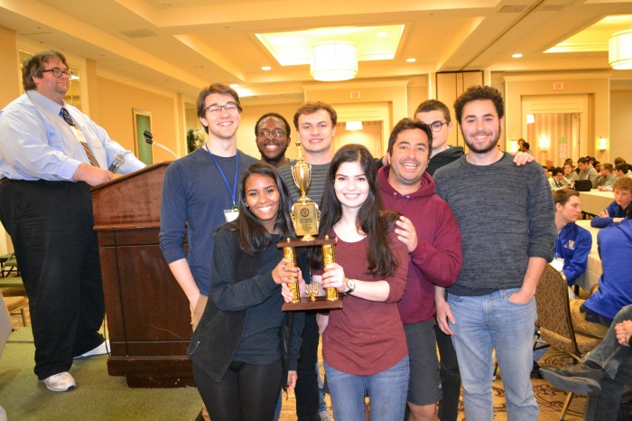 Oberlin College accepts the Best Small College trophy for the fourth year in a row.
